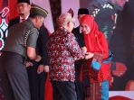 Hadiri HARGANAS Ke-30 di Banyuasin, Bupati Luwu Utara Raih Tanda Kehormatan Dari Presiden RI